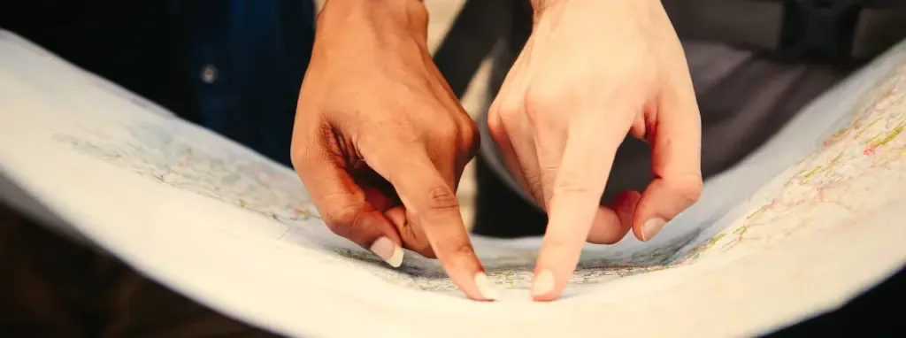 Fingers pointing on a map