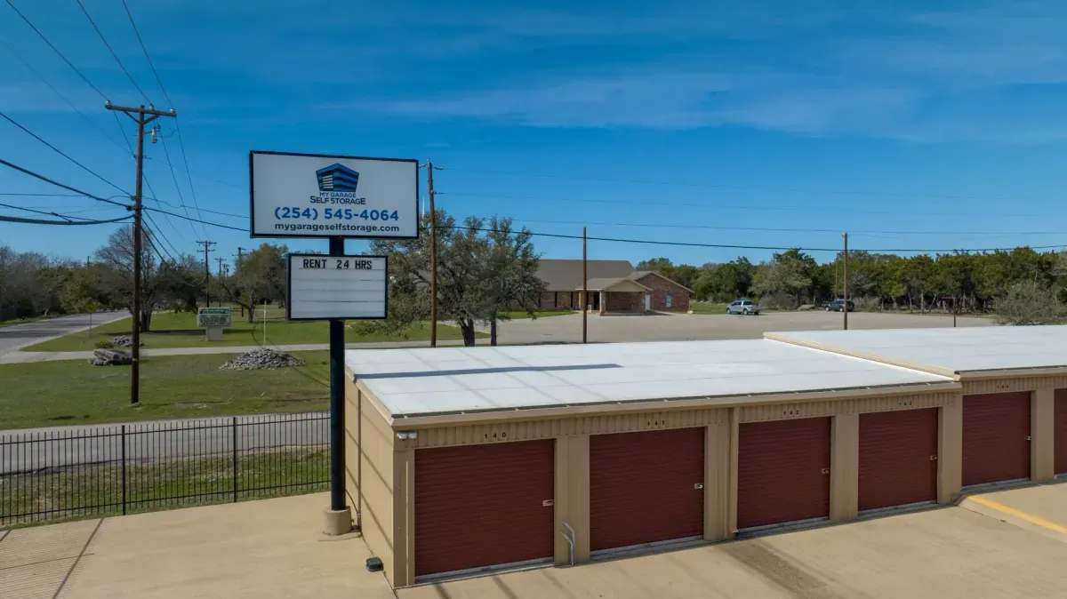 Outdoor rollup storage units with gated fence.